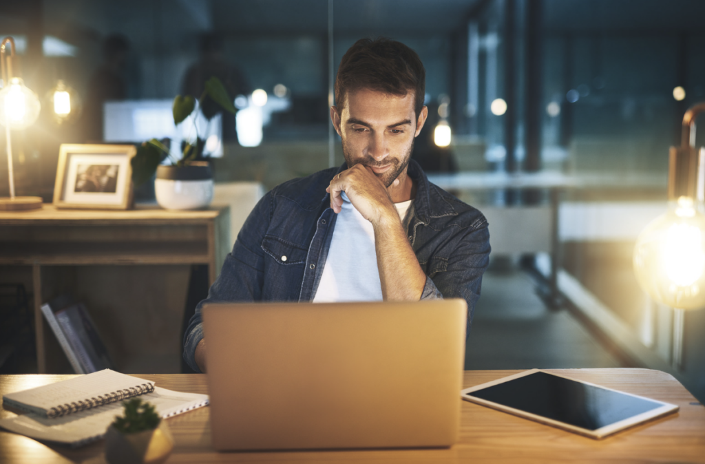Picture shows person working on a laptop, very focused, demonstrating the benefits of nootropics on well being
